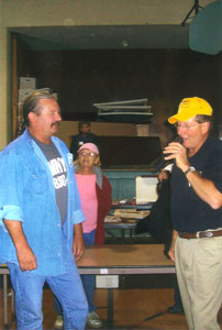 Gene Troka with auctioneer